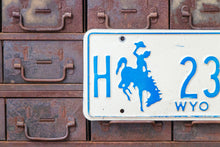 Load image into Gallery viewer, Wyoming 1977 License Plate Vintage White and Blue Wall Decor - Eagle&#39;s Eye Finds

