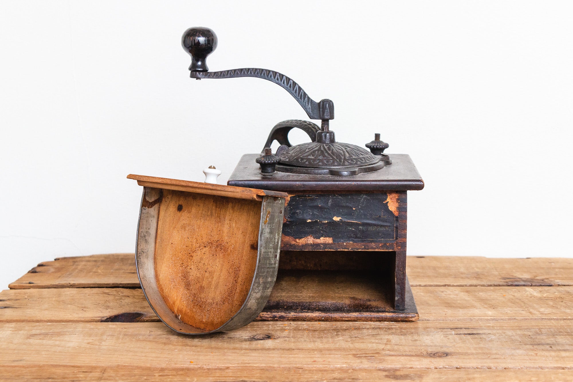 Vintage coffee grinder.Old retro hand-operated wooden and metal