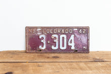 Load image into Gallery viewer, Colorado 1942 License Plate Vintage Maroon Wall Hanging Decor - Eagle&#39;s Eye Finds
