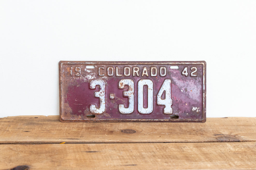 Colorado 1942 License Plate Vintage Maroon Wall Hanging Decor - Eagle's Eye Finds