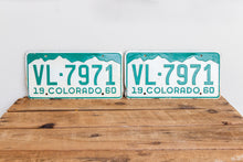 Load image into Gallery viewer, Colorado 1960 License Plate Pair Vintage White CO Wall Hanging Decor - Eagle&#39;s Eye Finds
