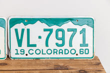 Load image into Gallery viewer, Colorado 1960 License Plate Pair Vintage White CO Wall Hanging Decor - Eagle&#39;s Eye Finds
