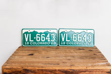 Load image into Gallery viewer, Colorado 1962 License Plate Pair Vintage NOS Green CO Wall Hanging Decor - Eagle&#39;s Eye Finds

