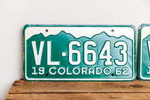 Load image into Gallery viewer, Colorado 1962 License Plate Pair Vintage NOS Green CO Wall Hanging Decor - Eagle&#39;s Eye Finds
