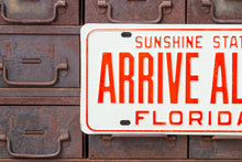 Load image into Gallery viewer, Arrive Alive 1972 Florida Booster License Plate Vintage Wall Decor - Eagle&#39;s Eye Finds
