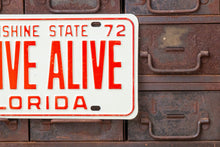 Load image into Gallery viewer, Arrive Alive 1972 Florida Booster License Plate Vintage Wall Decor - Eagle&#39;s Eye Finds

