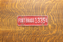 Load image into Gallery viewer, 1930s Fort Bragg North Carolina License Plate Topper Vintage NC
