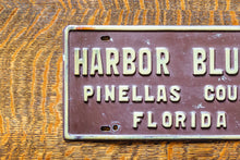 Load image into Gallery viewer, Harbor Bluffs Florida Booster License Plate Vintage FL Brown Wall Decor
