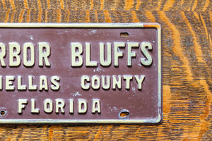 Harbor Bluffs Florida Booster License Plate Vintage FL Brown Wall Decor