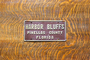 Harbor Bluffs Florida Booster License Plate Vintage FL Brown Wall Decor