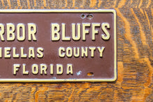 Load image into Gallery viewer, Harbor Bluffs Florida Booster License Plate Vintage FL Brown Wall Decor
