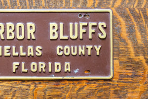 Harbor Bluffs Florida Booster License Plate Vintage FL Brown Wall Decor