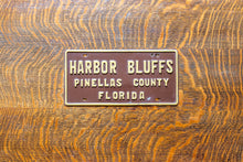 Load image into Gallery viewer, Harbor Bluffs Florida Booster License Plate Vintage FL Brown Wall Decor
