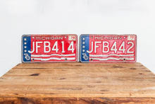 Load image into Gallery viewer, Michigan 1976 License Plate Pair Vintage USA Bicentennial Red White Blue Decor - Eagle&#39;s Eye Finds

