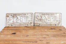 Load image into Gallery viewer, Michigan 1976 License Plate Pair Vintage USA Bicentennial Red White Blue Decor - Eagle&#39;s Eye Finds
