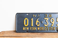 Load image into Gallery viewer, New York 1938 World&#39;s Fair Vintage Omnibus Taxi License Plate - Eagle&#39;s Eye Finds
