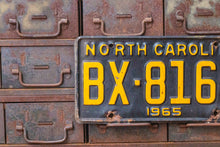 Load image into Gallery viewer, North Carolina 1965 License Plate Vintage Black Yellow Wall Hanging Decor - Eagle&#39;s Eye Finds
