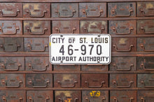 Load image into Gallery viewer, St. Louis Airport Authority Missouri Booster License Plate Vintage White Wall Hanging - Eagle&#39;s Eye Finds
