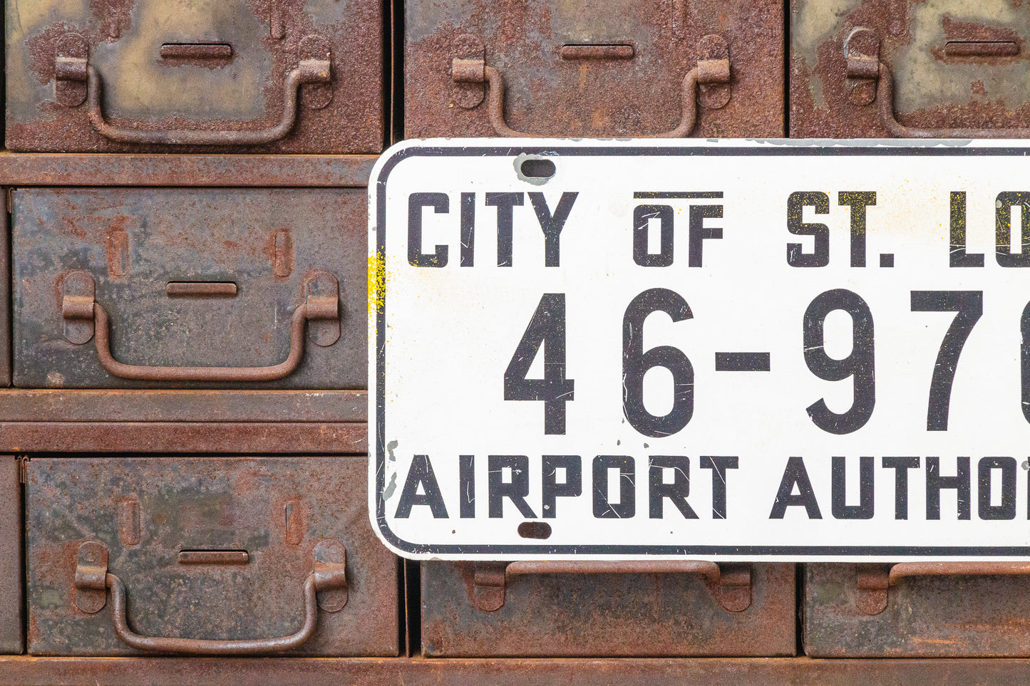St. Louis Airport Authority Missouri Booster License Plate Vintage White Wall Hanging - Eagle's Eye Finds