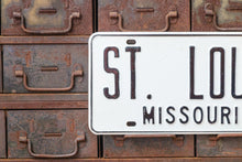 Load image into Gallery viewer, 1960s St. Louis Missouri Booster License Plate Vintage White Wall Hanging Decor - Eagle&#39;s Eye Finds
