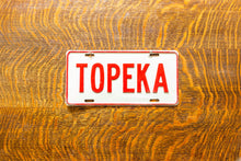 Load image into Gallery viewer, Topeka Kansas Booster License Plate Vintage Wall Decor
