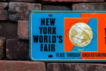 Load image into Gallery viewer, New York 1964 1965 World&#39;s Fair License Plate Vintage New York City Souvenir Booster Plate - Eagle&#39;s Eye Finds
