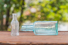 Load image into Gallery viewer, Chamberlain Medicine Bottles Vintage Aqua and Clear Apothecary Bottles - Eagle&#39;s Eye Finds
