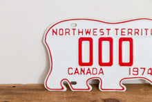 Load image into Gallery viewer, Northwest Territories 1974 Sample License Plate Polar Bear NWT Canada Vintage Wall Hanging Decor - Eagle&#39;s Eye Finds
