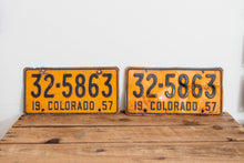 Load image into Gallery viewer, Colorado 1957 License Plate Pair Vintage Wall Hanging Decor - Eagle&#39;s Eye Finds
