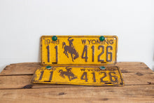 Load image into Gallery viewer, Wyoming 1948 License Plate Pair Vintage Wall Hanging Decor - Eagle&#39;s Eye Finds
