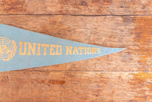 Load image into Gallery viewer, United Nations Baby Blue Felt Pennant Vintage Wall Decor - Eagle&#39;s Eye Finds

