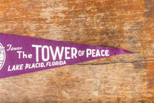 Load image into Gallery viewer, Tower of Peace Florida Felt Pennant Vintage Purple Lake Placid FL Wall Decor - Eagle&#39;s Eye Finds
