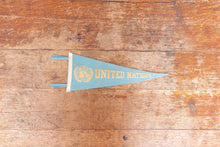 Load image into Gallery viewer, United Nations Baby Blue Felt Pennant Vintage Wall Decor - Eagle&#39;s Eye Finds
