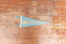 Load image into Gallery viewer, United Nations Baby Blue Felt Pennant Vintage Wall Decor - Eagle&#39;s Eye Finds
