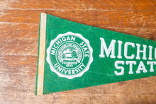 Load image into Gallery viewer, Michigan State University Felt Pennant Vintage College Wall Decor - Eagle&#39;s Eye Finds
